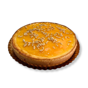 Tarta de queso con yema y piñones